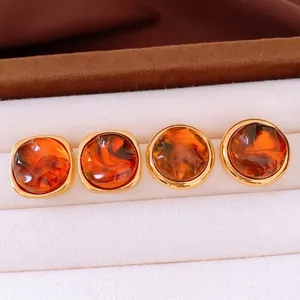 Vintage amber resin earrings with gold metal rim in square and round geometric shapes