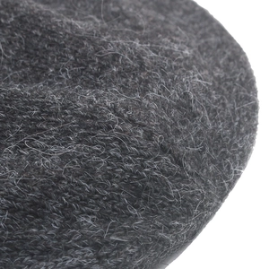 Detailed macro view of dark grey rabbit fur knit fabric texture and soft warm fibers