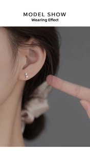 Close-up model shot of delicate 925 sterling silver tulip stud earrings for women