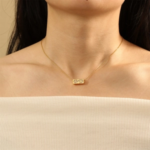 Macro shot of 18K gold plated necklace with infinity symbol pendant and cubic zirconia