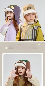 Detail of color-block kids winter trapper hat with warm plush lining and ear flaps