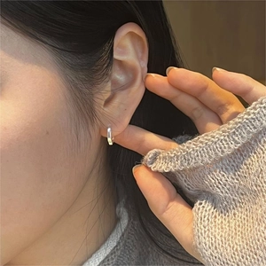 Minimalist 925 sterling silver hexagonal hoop earrings worn for a modern lifestyle look