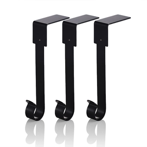 Three heavy-duty black metal mantel hooks for Christmas stockings on white background