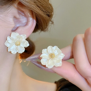 Minimalist white resin flower stud earrings with a pearl luster finish for women