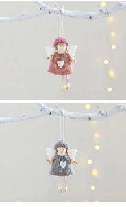 Detail of pink and grey knitted angel ornaments with heart motifs for Christmas trees