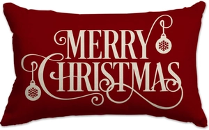 Detail of red linen pillowcase with cream Merry Christmas print and festive ornaments