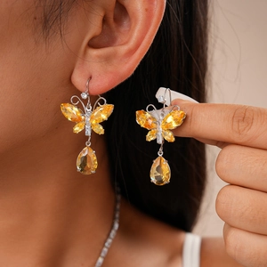 Elegant silver butterfly earrings with yellow crystals and water drop pendants