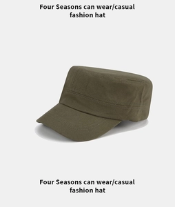 Detail view of olive green flat top cadet cap with reinforced double-row stitching