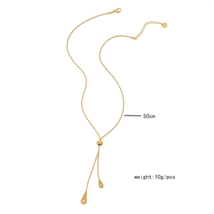 Detail of adjustable gold snake chain necklace with teardrop tassels and 50cm length