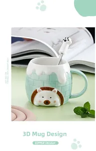 Detail view of a 3D hedgehog relief ceramic mug with a cute cat paw stir spoon