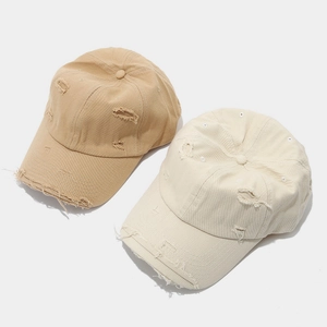 Distressed vintage baseball caps in khaki and beige featuring retro washed cotton fabric