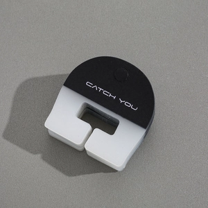 Detail of minimalist hair claw clip in black and white with Catch You text print