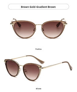 Detail of oversized cat eye sunglasses with brown golden frames and gradient brown lenses