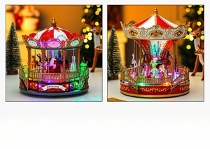 Detail of a rotating Christmas carousel music box with colorful LED lights and festive design