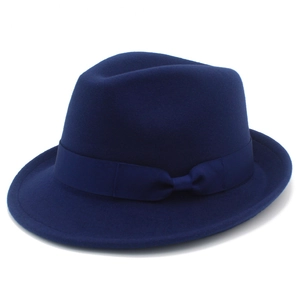 Detail of navy blue wool fedora hat featuring a matching decorative ribbon bow