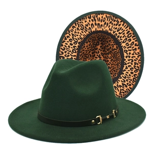 Detail of dark green fedora hat featuring gold buckle and stylish leopard print lining
