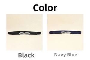 Detail of leaf-shaped rhinestone buckle on elastic waist belts in black and navy