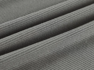 Close-up of dark grey high-stretch ribbed knit fabric texture and soft cotton fibers