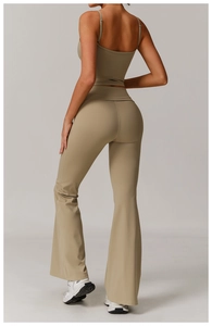 Back view of yoga set featuring thin strap top and high-waisted flared leggings