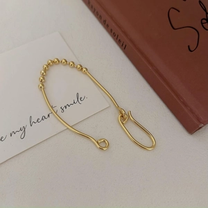 Elegant 925 sterling silver golden bead bracelet shown in a minimalist lifestyle setting