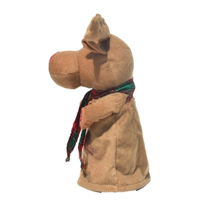 Plush Christmas reindeer toy with red-green plaid scarf standing in a side profile view