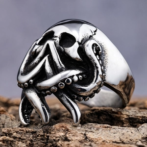 Vintage silver Punisher skull and octopus tentacle stainless steel ring on bark