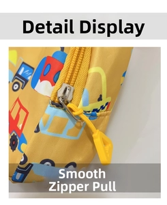 Detail of yellow zipper and triangle puller on cartoon vehicle children chest bag