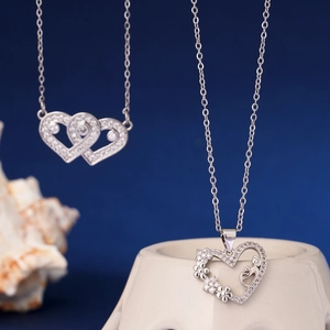 Silver heart necklace with zircon stones featuring double hearts and floral patterns