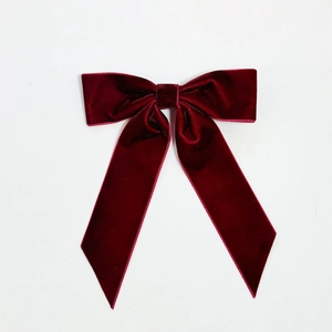 Classic deep red velvet bow hair clip with long streamers for elegant styling