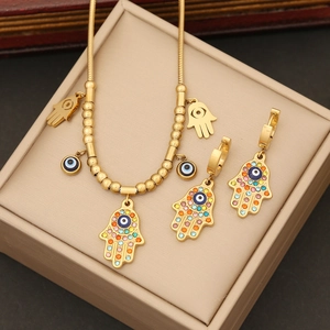 Golden Hamsa hand and Evil Eye jewelry set with colorful rhinestones on snake chain