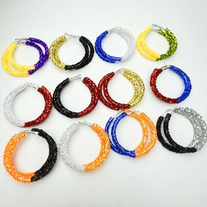Close-up of glitter rhinestone hoop earrings in twelve multi-color team sports combinations