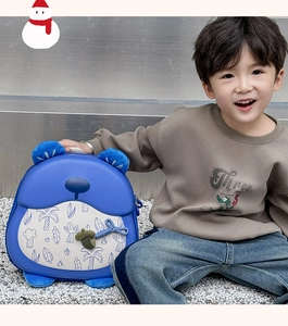 Blue hard shell kids backpack with cute bear ears and acorn detail shown on model