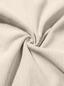 Macro shot of cream corduroy fabric texture showing vertical stripes and soft drape