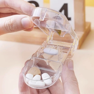 Portable transparent pill cutter with sharp blade and built-in storage container
