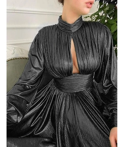 Detailed view of the metallic pleated texture and hollow chest cutout on dark grey dress
