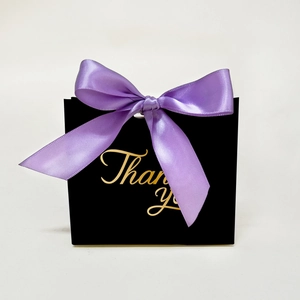 Elegant black European wedding favor bag with purple ribbon and gold Thank You lettering