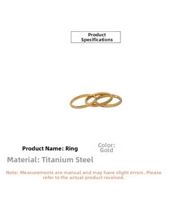Detailed view of titanium steel rings featuring polished gold finish and sandblasted texture