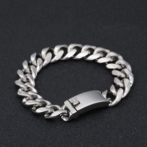 Close-up of a silver titanium steel Cuban link chain with a polished rectangular clasp