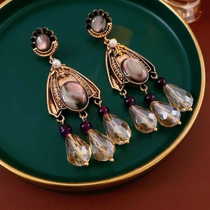 Vintage crystal tassel earrings with floral accents and sparkling champagne drops