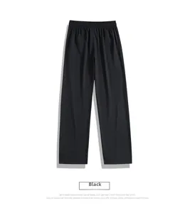 Detail of black ice silk trousers showing the elastic drawstring waistband and soft texture