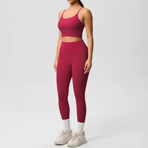 Detailed side view of high-stretch burgundy yoga set with sports bra and leggings