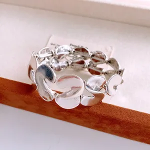 Silver wide stretch bracelet with textured leaf-shaped metal links for women