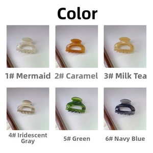 Detailed view of handmade acetate hair claw clips in six elegant translucent colors