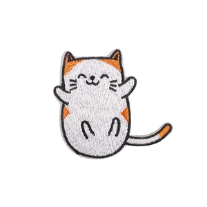 Cartoon cat embroidered iron-on patch with detailed white and orange feline stitching
