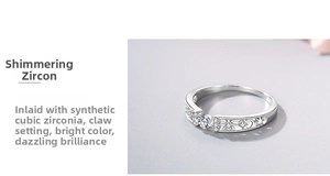 Detail of star and moon cutouts on silver ring with prong-set cubic zirconia stone
