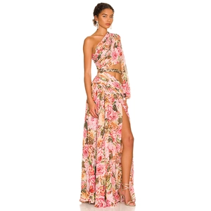 Detail of floral print maxi dress with waist cutout and gold chain belt detail