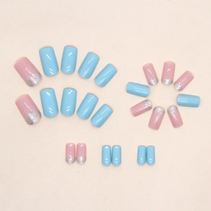 Square press-on nails in light blue and pink glitter gradient with a glossy finish