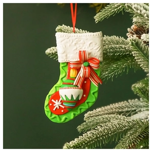 Macro detail of Christmas stocking ornament with festive textures hanging on snowy tree