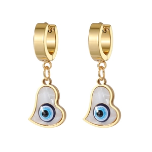 Gold evil eye heart dangle earrings with white shell inlay and blue charm on white background