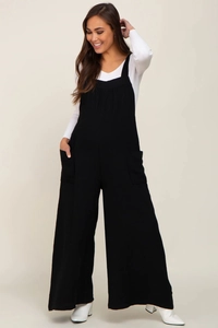 Detail of black maternity overall wide-leg trousers with front pockets and tie straps